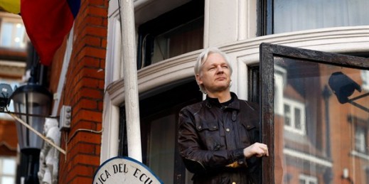 Julian Assange greets supporters outside the Ecuadorian Embassy in London, May 19, 2017 (AP photo by Frank Augstein).
