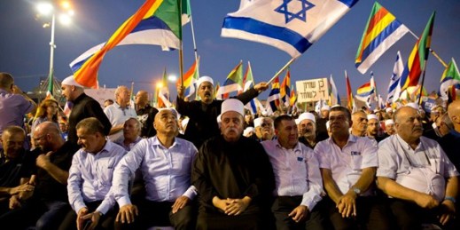 Druze Spiritual Leader Sheik Mowafaq Tafik, center, at a rally against a contentious new law that critics say sidelines Israel’s non-Jewish citizens, Tel Aviv, Israel, Aug. 4, 2018 (AP photo by Sebastian Scheiner).