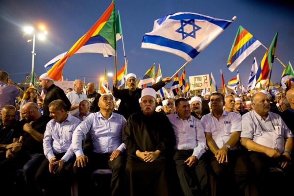 Druze Spiritual Leader Sheik Mowafaq Tafik, center, at a rally against a contentious new law that critics say sidelines Israel’s non-Jewish citizens, Tel Aviv, Israel, Aug. 4, 2018 (AP photo by Sebastian Scheiner).