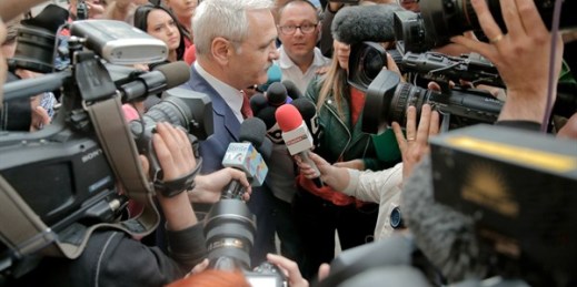 Liviu Dragnea, the head of Romania’s Social Democratic Party, is surrounded by media as he arrives at the anti-corruption prosecutors’ office, Bucharest, Romania, April 27, 2018 (AP photo by Vadim Ghirda).