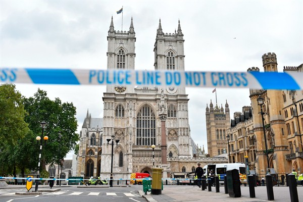 Police officers secure the roads around the Houses of Parliament after a vehicle crashed into security barriers, injuring a number of pedestrians, Aug. 14, 2018, London, England (Photo by Alberto Pezzali for Sipa USA via AP Images).
