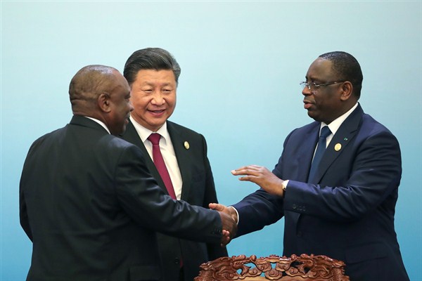 South African President Cyril Ramaphosa, left, shakes hands with Senegalese President Macky Sall, right, with Chinese President Xi Jinping, center, during the Forum On China-Africa Cooperation in Beijing, Sept. 4, 2018 (AP photo by Lintao Zhang).