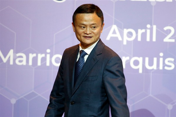 Jack Ma, the founder and chairman of Alibaba, leaves a press conference in Bangkok, Thailand, April 19, 2018 (AP photo by Sakchai Lalit).