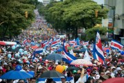 Thousands of people march to demand that Costa Rican President Carlos Alvarado scrap a proposed fiscal reform before congress that includes new taxes, in the streets of San Jose, Costa Rica, Sept. 12, 2018 (AP Photo by Carlos Gonzalez).