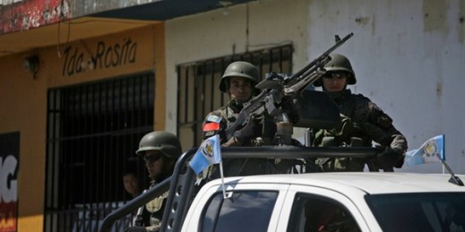 Heavily armed soldiers escort the caravan of Guatemalan President Jimmy Morales to a ceremony to inaugurate a soccer field, Mixco, Guatemala, Sept. 17, 2018 (AP photo by Moises Castillo).
