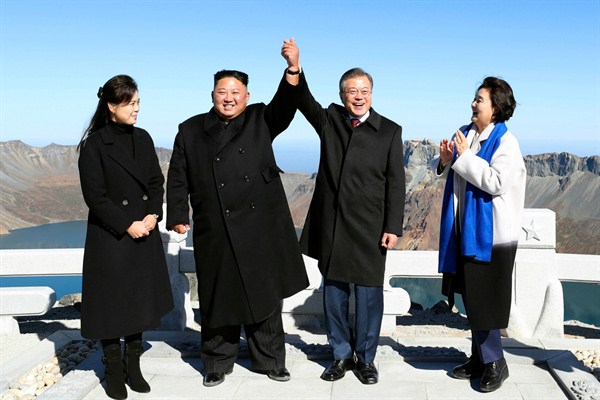 North Korean leader Kim Jong Un (2nd from left) and South Korean President Moon Jae-in (2nd from right) pose with their wives on Mt. Paektu, a volcano on the North Korean-Chinese border, on Sept. 20, 2018 (Kyodo photo via AP).