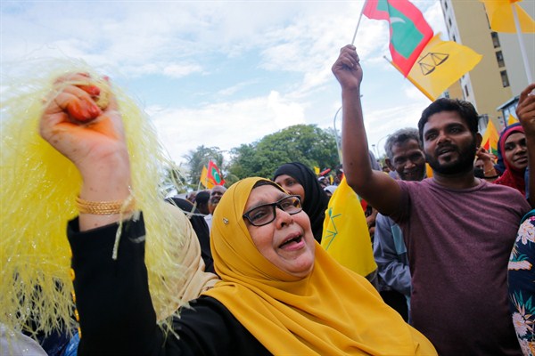 Supporters of Ibrahim Mohamed Solih, the president-elect of the Maldives, celebrate his election win, Maldives, Sept. 24, 2018 (AP photo by Eranga Jayawardena).