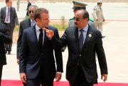 Mauritania’s president, Mohamed Ould Abdel Aziz, welcomes his French counterpart Emmanuel Macron upon his arrival at Nouakchott airport, Mauritania, July 2, 2018 (AP photo by Ludovic Marin).