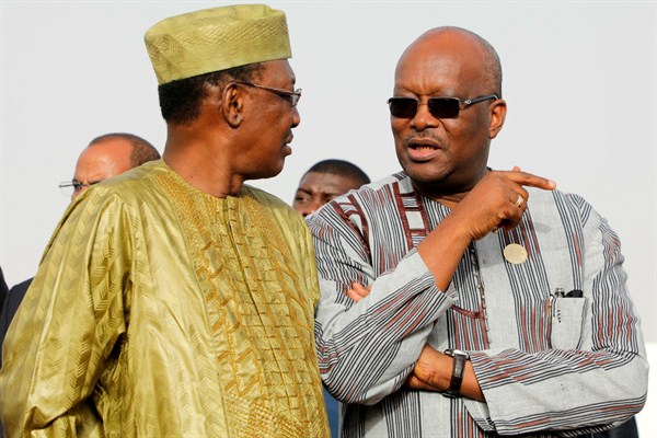 Chad’s president, Idriss Deby, left, listens to Burkina Faso’s president, Roch Marc Christian Kabore, before a working session of the African Union in Nouakchott, Mauritania, July 3, 2018 (AP photo by Ludovic Marin).