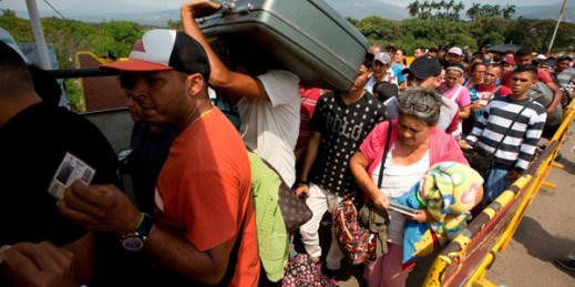 Venezuelan migrants cross the Simon Bolivar International Bridge into Colombia, Feb. 21, 2018 (AP photo by Fernando Vergara).