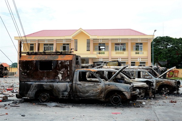 A row of charred vehicles is seen at a fire and police station, Binh Thuan province, Vietnam, June 12, 2018 (AP photo).