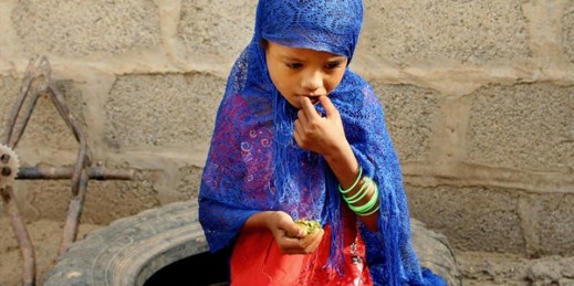 A girl eats boiled leaves from a local vine to stave off starvation, in the extremely impoverished district of Aslam, Hajjah, Yemen (AP photo by Hammadi Issa).