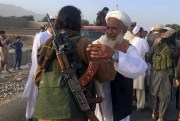 Taliban fighters gather with residents to celebrate a three-day cease fire marking the Islamic holiday of Eid al-Fitr, in Nangarhar province, east of Kabul, Afghanistan, June 16, 2018 (AP photo by Ramat Gul).