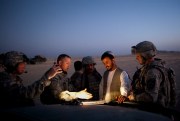 U.S. Lt. Col. William Clark, second from left, talks with Gen. Abdul Raziq, a police commander in southern Afghanistan, on the outskirts of Spin Boldak, Afghanistan, Aug. 7, 2009 (AP photo by Emilio Morenatti).