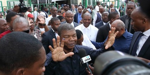 Angola’s newly inaugurated president, Joao Lourenco, shows his ink-stained finger as he faces the media after casting his vote in the recent election, Luanda, Angola, Aug. 23, 2017 (AP photo by Bruno Fonseca).