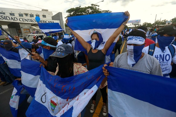 Anti-government protesters march outside Central American University, Managua, Nicaragua, Sept. 26, 2018 (AP photo by Alfredo Zuniga).