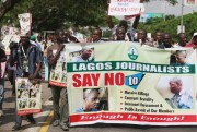 Journalists protest against brutality in the course of doing their job after photo journalist Benedict Uwalaka was beaten up in Lagos, Nigeria, Aug. 16, 2012 (AP photo by Sunday Alamba).