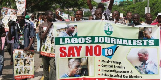 Journalists protest against brutality in the course of doing their job after photo journalist Benedict Uwalaka was beaten up in Lagos, Nigeria, Aug. 16, 2012 (AP photo by Sunday Alamba).