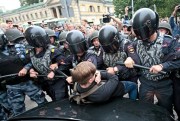 Russian police officers harass a teenager during a rally against increasing the retirement age, St. Petersburg, Russia, Sept. 9, 2018 (AP photo by Valentin Egorshin).