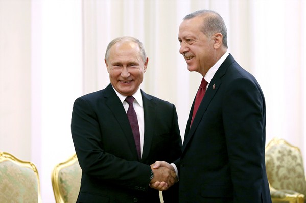 Russian President Vladimir Putin and Turkish President Recep Tayyip Erdogan shake hands during a meeting to discuss the Syrian conflict, Tehran, Iran, Sept. 7, 2018 (AP photo by Ebrahim Noroozi).