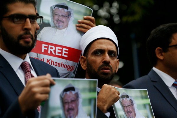 Members of the Turkish-Arab Media Association hold posters with photos of missing Saudi writer Jamal Khashoggi near the Saudi consulate in Istanbul, Turkey, Oct. 8, 2018 (AP photo by Lefteris Pitarakis).
