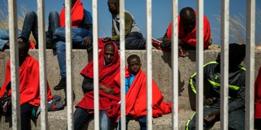 Migrants wait to be transported to a police station after being rescued in the Strait of Gibraltar, Algeciras, Spain, June 26, 2018 (AP photo by Emilio Morenatti).