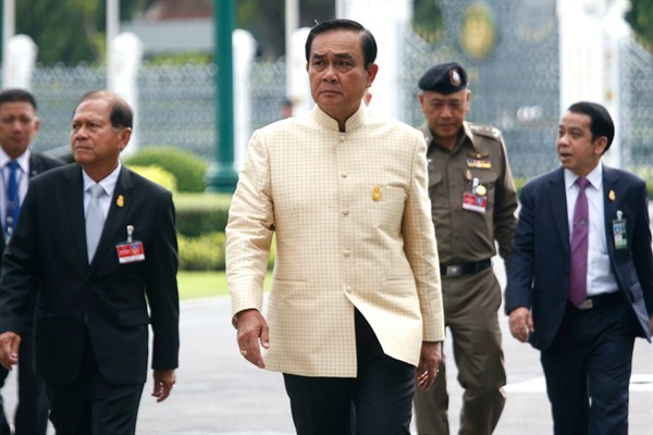 Thai Prime Minister Prayuth Chan-ocha, center, arrives at Government House for a Cabinet meeting in Bangkok, Thailand, Sept. 11, 2018 (AP photo by Sakchai Lalit).