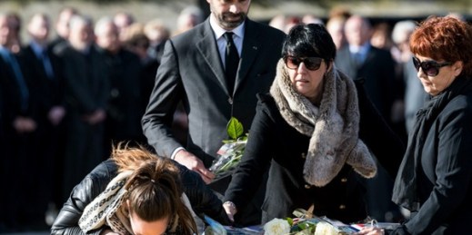 A daughter of Christian Medves kisses her father’s coffin during a ceremony for three victims of an extremist gun rampage in March 2018 in Trebes, southern France, March 29, 2018 (AP photo by Fred Lancelot).