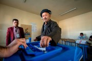 A Kurdish man casts a ballot during parliamentary elections in the autonomous region of Kurdistan, Iraq, Sept. 30, 2018 (DPA photo by Tobias Schreiner via AP Images).