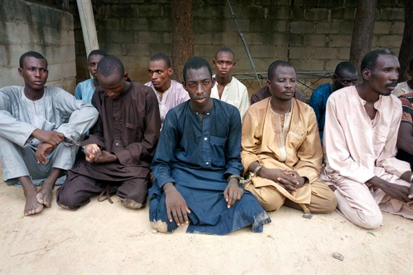 A group of men identified by Nigerian police as Boko Haram extremist fighters and leaders are presented to the media, Maiduguri, Nigeria, July 18, 2018 (AP photo by Jossy Ola).