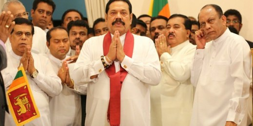 Sri Lanka’s newly appointed prime minister, Mahinda Rajapaksa, center, prays with lawmakers in Colombo, Sri Lanka, Oct. 29, 2018 (AP photo by Lahiru Harshana).