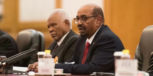 Sudanese President Omar al-Bashir, right, at the Great Hall of the People in Beijing, Sept. 2, 2018 (Pool photo by Nicolas Asfouri via AP Images).