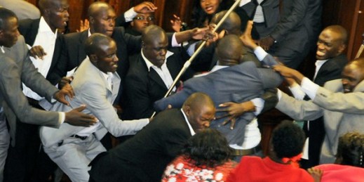 Ugandan opposition MPs scuffle with security trying to eject some of the MPs from Parliament during a debate on the presidential age limit, Kampala, Uganda (AP photo by Ronald Kabuubi).