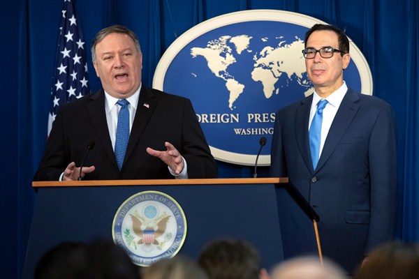 Secretary of State Mike Pompeo, left, and Treasury Secretary Steven Mnuchin, present details of the new sanctions on Iran, at the Foreign Press Center in Washington, Nov. 5, 2018 (AP photo by 	J. Scott Applewhite).