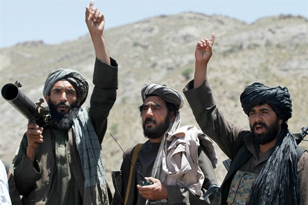 Taliban fighters react to a speech by their senior leader in the Shindand district of Herat province, Afghanistan, May 27, 2016 (AP photo by Allauddin Khan).