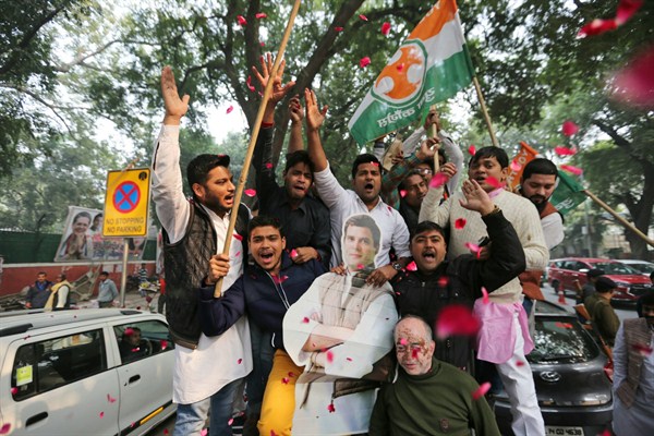 Supporters of India’s opposition Congress party hold a cut-out of party leader Rahul Gandhi as they celebrate outside the party headquarters in New Delhi, India, Dec. 11, 2018 (AP photo).
