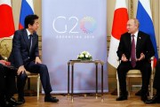 Russian President Vladimir Putin and Japanese Prime Minister Shinzo Abe hold a summit meeting in Buenos Aires, Argentina, Dec. 1, 2018 (Photo by Shuhei Yokoyama for Yomiuri Shimbun via AP Images).
