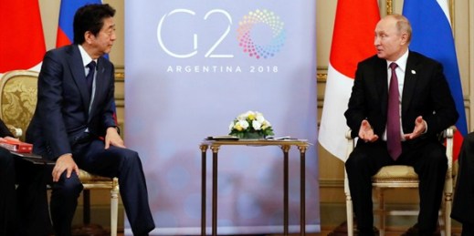 Russian President Vladimir Putin and Japanese Prime Minister Shinzo Abe hold a summit meeting in Buenos Aires, Argentina, Dec. 1, 2018 (Photo by Shuhei Yokoyama for Yomiuri Shimbun via AP Images).