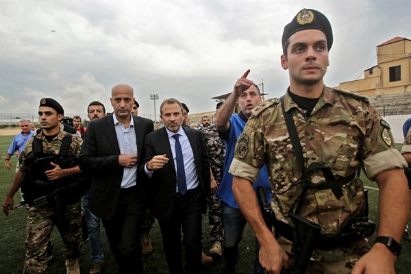 Lebanese Foreign Minister Gebran Bassil leaves a stadium after a tour organized for diplomats and journalists, Beirut, Oct. 1, 2018 (Photo by Marwan Naamani for dpa via AP Images).