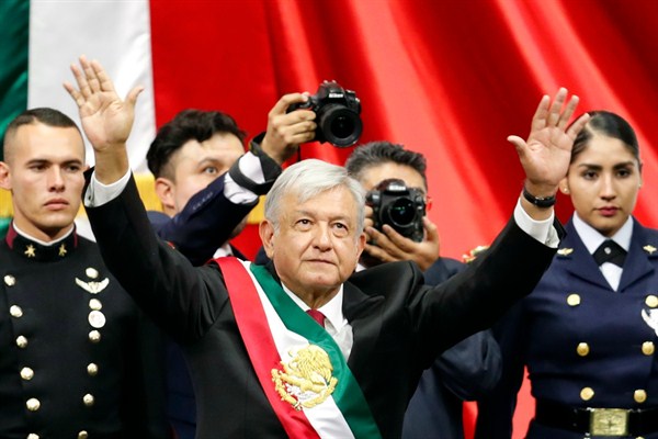 Mexico’s new president, Andres Manuel Lopez Obrador, greets the crowd at the end of his inauguration ceremony, Mexico City, Dec. 1, 2018 (AP photo by Eduardo Verdugo).
