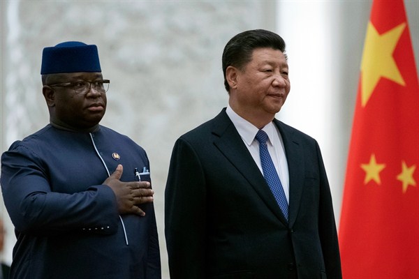Chinese President Xi Jinping and Julius Maada Bio, president of Sierra Leone, stand during a welcoming ceremony at the Great Hall of the People, Beijing, China, Aug. 30, 2018 (Pool photo by Roman Pilipey via AP Images).