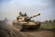 Turkish army tanks head for the Syrian border town of Afrin, an enclave in northwestern Syria controlled by Kurdish fighters, Hassa, Turkey, Jan. 22, 2018 (AP photo).