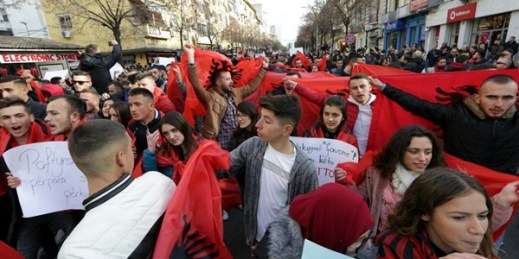 University and school students wave Albanian flags as they protest in Tirana, Dec. 11, 2018 (AP photo by Hektor Pustina).