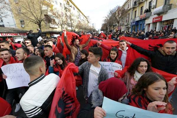University and school students wave Albanian flags as they protest in Tirana, Dec. 11, 2018 (AP photo by Hektor Pustina).
