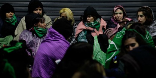 Argentine women who support decriminalizing abortion sit outside Congress, where lawmakers were debating the issue, Buenos Aires, Argentina, Aug. 9, 2018 (AP photo by Natacha Pisarenko).