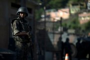 A soldier patrols in the Chapadao complex of favelas in Rio de Janeiro, Brazil, Dec. 11, 2018 (AP photo by Leo Correa).