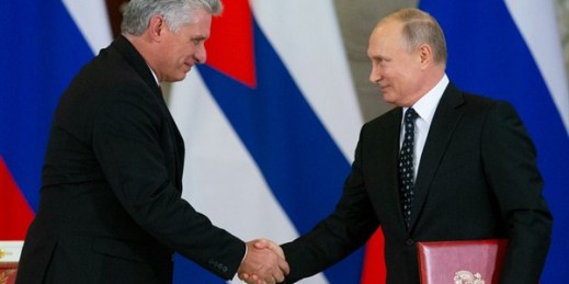 Russian President Vladimir Putin and Cuban President Miguel Diaz-Canel shake hands while exchanging documents after their talks in the Kremlin, Moscow, Russia, Nov. 2, 2018 (AP photo by Alexander Zemlianichenko).