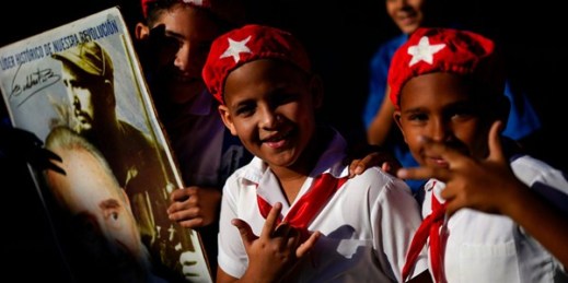 Young Cubans attend a march celebrating the 60th anniversary of the arrival of Fidel Castro and his rebel army to Regla, an area within Havana, Cuba, Jan. 8, 2019 (AP photo by Ramon Espinosa).