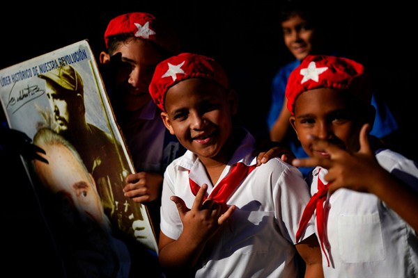 Young Cubans attend a march celebrating the 60th anniversary of the arrival of Fidel Castro and his rebel army to Regla, an area within Havana, Cuba, Jan. 8, 2019 (AP photo by Ramon Espinosa).