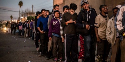 Migrants line up at a food counter in Tijuana, Mexico, Nov. 28, 2018 (Photo by Omar Martinez for dpa via AP Images).